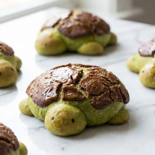 Matcha Milk Bread Turtles featuring a brown butter tangzhong infusion and a cracked Dutch crunch shell.