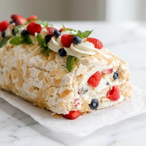 Golden-brown meringue roulade with a stable, marshmallowy center achieved with a vinegar and cream of tartar infusion.