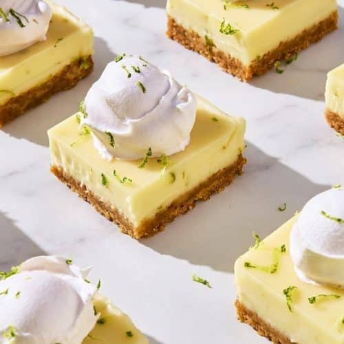 Creamy key lime pie bars featuring a salty miso-infused graham cracker crust and fresh lime zest.