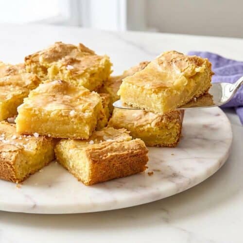 Sliced neiman marcus cake featuring a browned butter and sea salt base for a rich, golden finish.