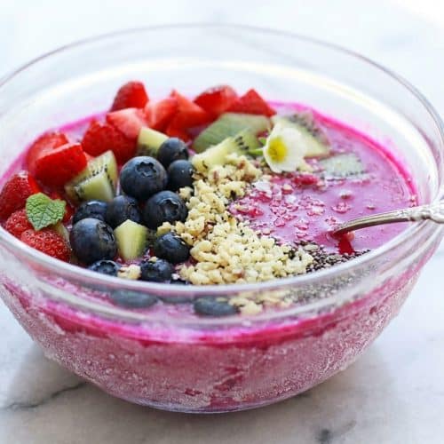 Vibrant pitaya bowls using a flash-frozen technique for a thick, frosty texture and a flavor-enhancing pinch of salt.