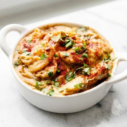 Golden brown pollo fundido recipe with a double-browned crust and melted jalapeño cream cheese topping.