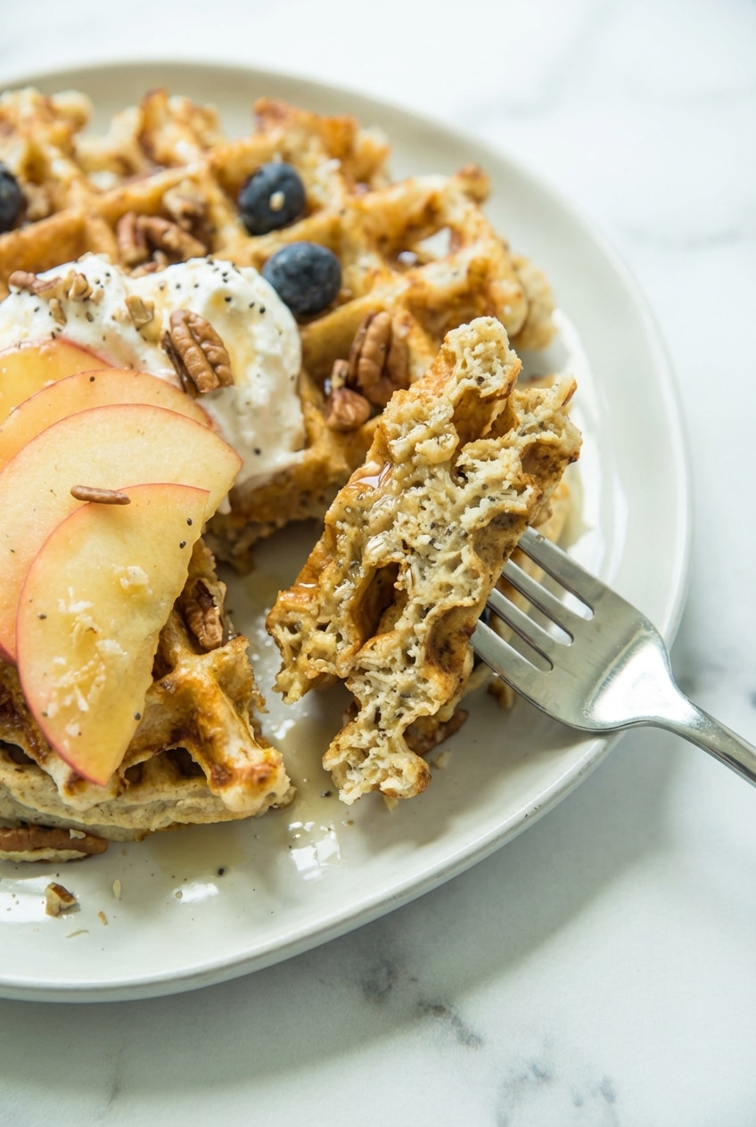 Close-up of the airy crumb and golden surface of this protein waffles recipe showing the perfect interior texture.
