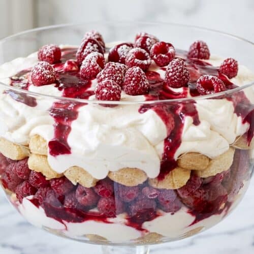 Raspberry tiramisu featuring the double-berry coulis soak for vibrant, fruit-infused layers.