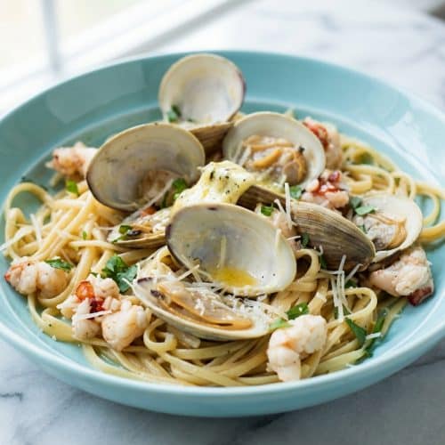 Linguine seafood pasta tossed in a glossy lemon-anchovy compound butter and starchy pasta water sauce.
