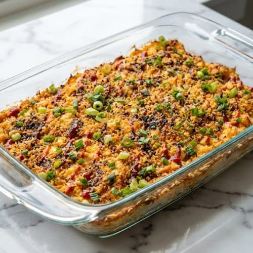 Spicy Salmon Sushi Bake casserole topped with crispy toasted panko and drizzled with spicy mayo and eel sauce.