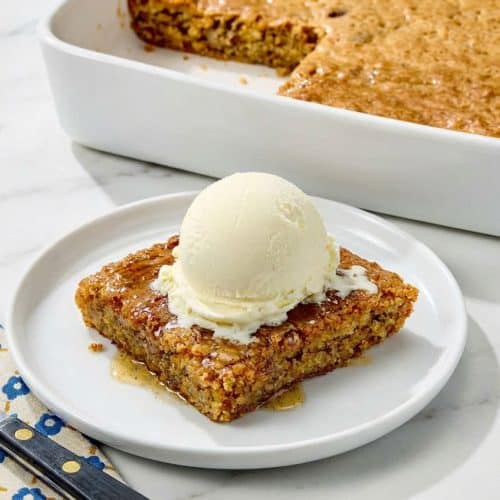 Slices of sweet Alabama pecan bread featuring a rich browned butter and bourbon infusion on a serving platter.