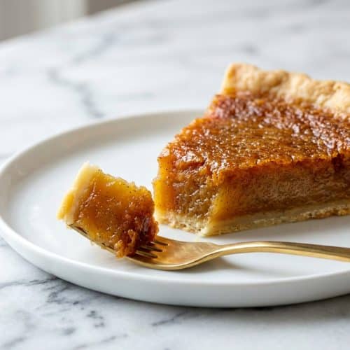 A creamy sliced vinegar pie recipe featuring a golden custard filling made with browned butter and vanilla bean paste.