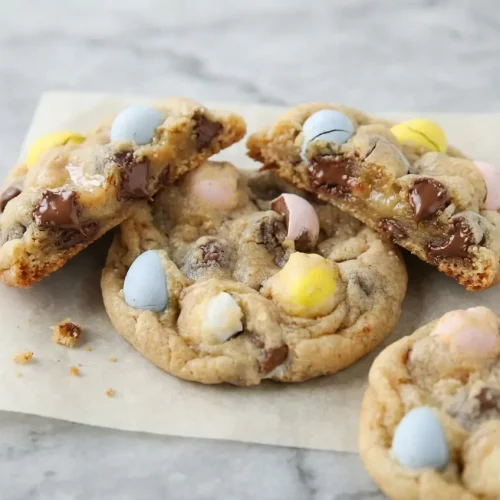 Brown butter Cadbury Egg Cookies with a hint of malted milk powder and pastel candy shells.