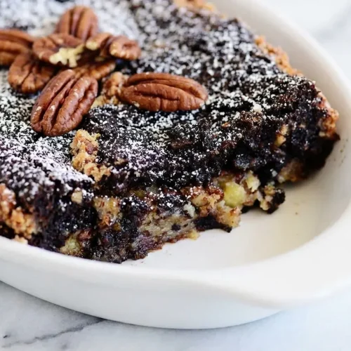 Chocolate Pecan Ooey Gooey Butter Cake with a nutty brown butter crust and sea salt toasted pecans.