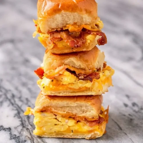 Golden Crack Breakfast Sliders topped with Everything Bagel Seasoning and a savory-sweet maple-butter glaze.