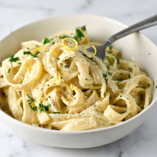Creamy boursin pasta tossed with fettuccine, finished with bright lemon zest and a touch of warm nutmeg.