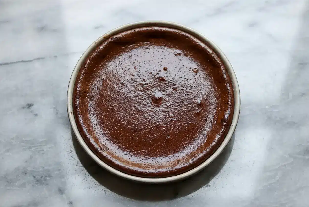 Slices of French Chocolate Flan showing an espresso-infused custard center and a crisp shortcrust pastry edge.
