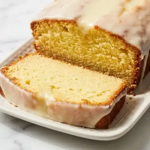 Glazed Italian Lemon Pound Cake made with olive oil and sugar-rubbed zest for deep citrus flavor.