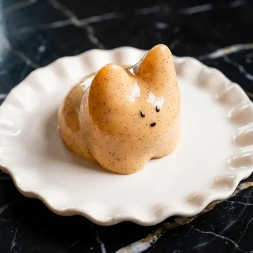 A prepared Jiggly Cat Pudding Recipe showing the 3:1 milk and heavy cream base infused with real vanilla bean specks.