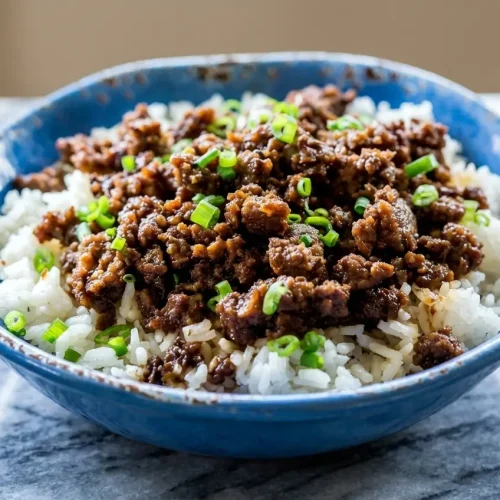 Savory Korean Ground Beef Bowl with a glossy gochujang-honey caramelized glaze served over fluffy jasmine rice.