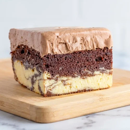Italian Love Cake featuring an orange-zest ricotta layer and mini chocolate chips for a citrusy, rich finish.