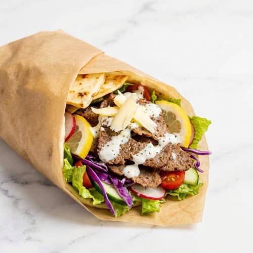 Slices of Parchment Doner Kebab with crispy edges made using the frozen butter grate technique.