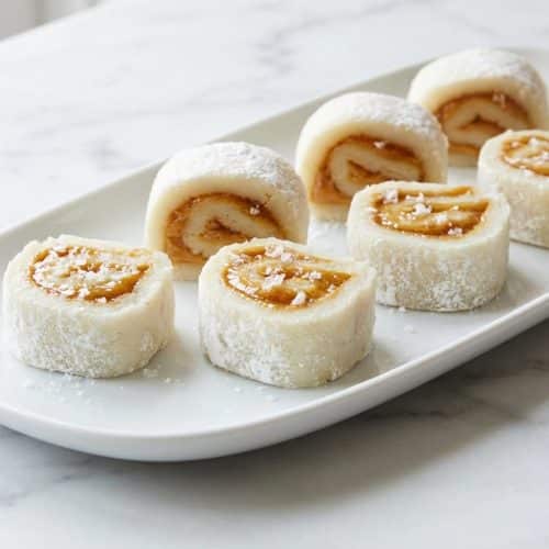 Sliced rolls from this potato candy recipe featuring a browned butter and flaky sea salt peanut butter filling.