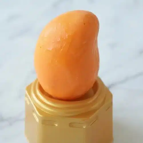 Propitious Mango Ice Cream Recipe with a crisp white chocolate shell revealing a roasted mango puree center.