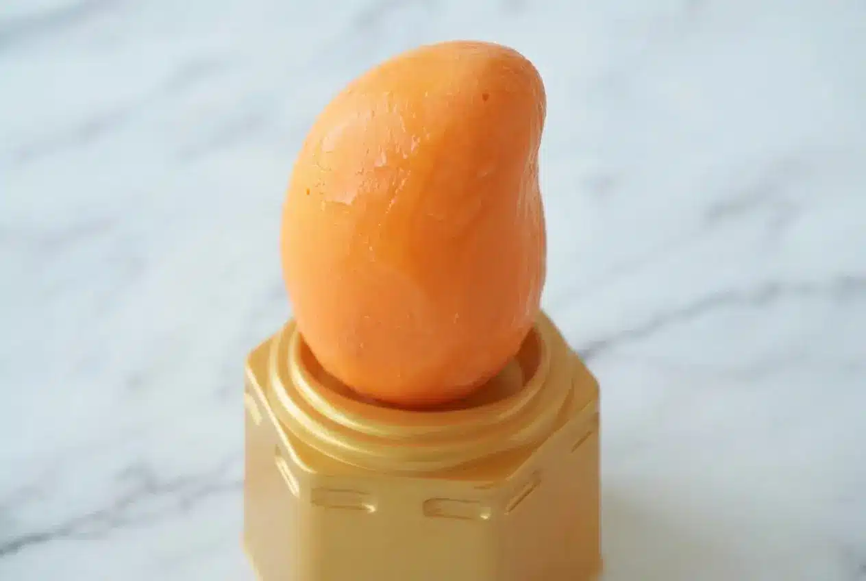 Propitious Mango Ice Cream Recipe with a crisp white chocolate shell revealing a roasted mango puree center.