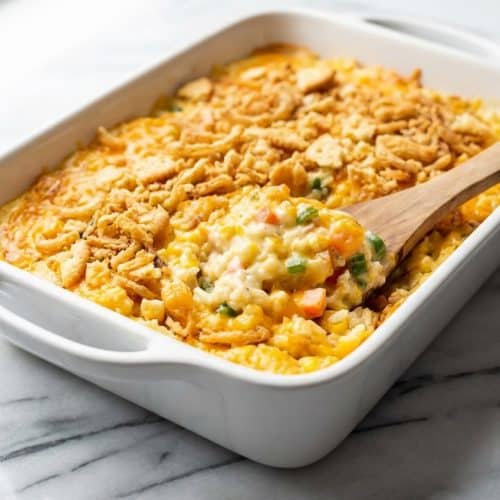 Rotisserie chicken and rice casserole topped with a buttery Ritz cracker and crispy onion crunch.