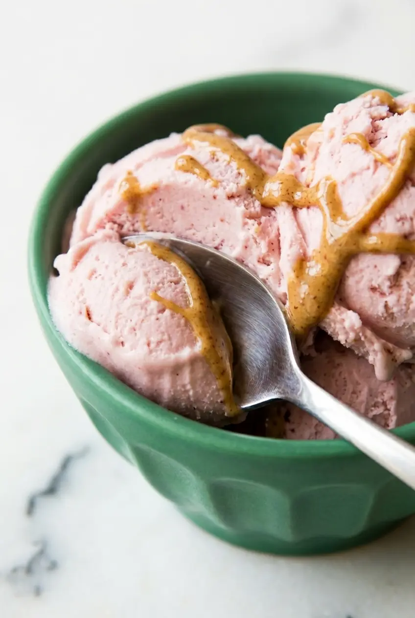Close up view of the velvety smooth, scoopable texture of High Protein Cottage Cheese Ice Cream with no ice crystals.