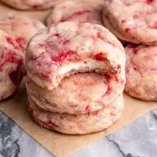 Strawberry cheesecake cookies with a toasted brown butter graham cracker base and creamy filling.