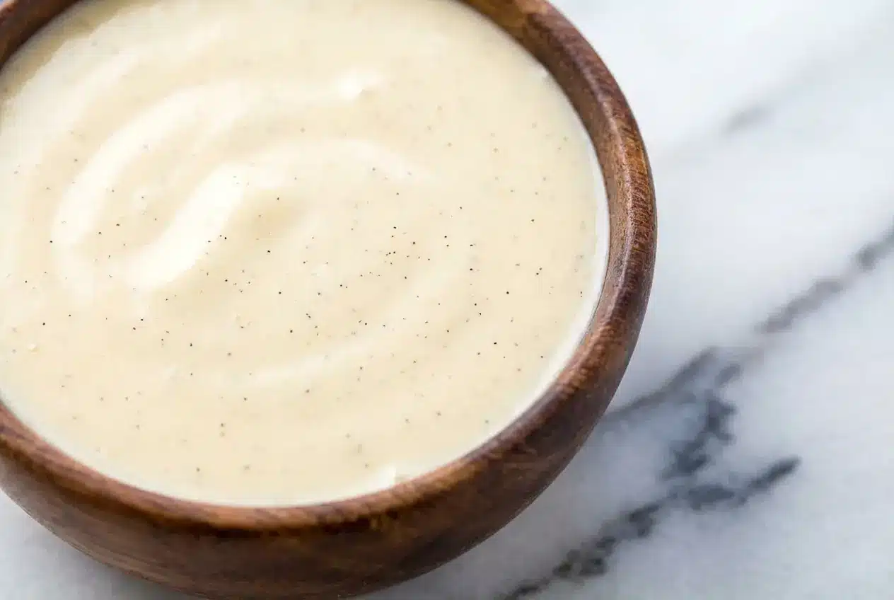 Creamy Tahitian Vanilla Sauce Recipe spooned over pan-seared fish, finished with a bright squeeze of lime and mounted butter.