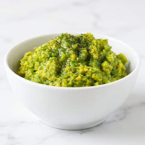 A small glass jar of vibrant green paste for this yuzu kosho recipe, enhanced with powdered kombu and fresh yuzu juice.