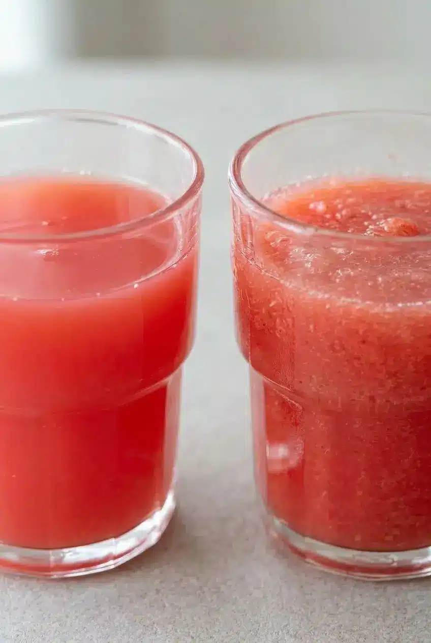 A side-by-side comparison of two glasses of watermelon juice, one showing smooth, strained juice and the other showing thicker, unstrained