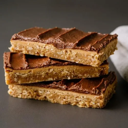 Chewy Lunch Lady Peanut Butter Bars with rich peanut butter center and dark chocolate frosting.