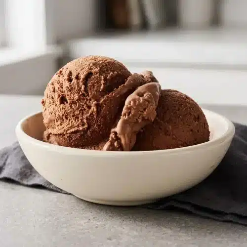 A rich and scoopable serving of homemade chocolate ice cream with a velvety texture.