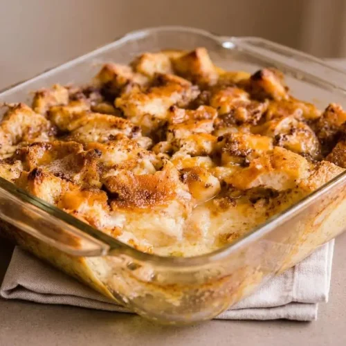 Freshly baked bread pudding recipe with golden toasted edges and a fragrant cinnamon custard center.