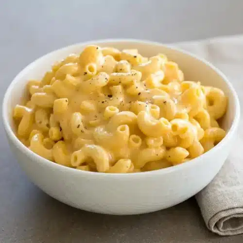 Creamy crockpot mac and cheese with tender elbow noodles coated in a rich, glossy cheddar sauce.