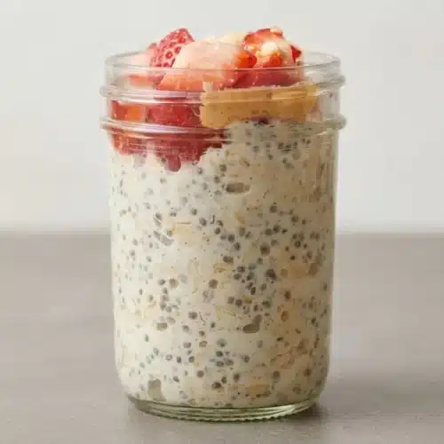 Creamy overnight oats recipe served chilled with a thick pudding-like texture.