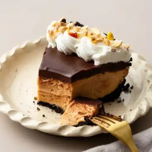 Peanut butter pie recipe with a silky chocolate ganache layer, fluffy mousse filling, and dark cookie crust.