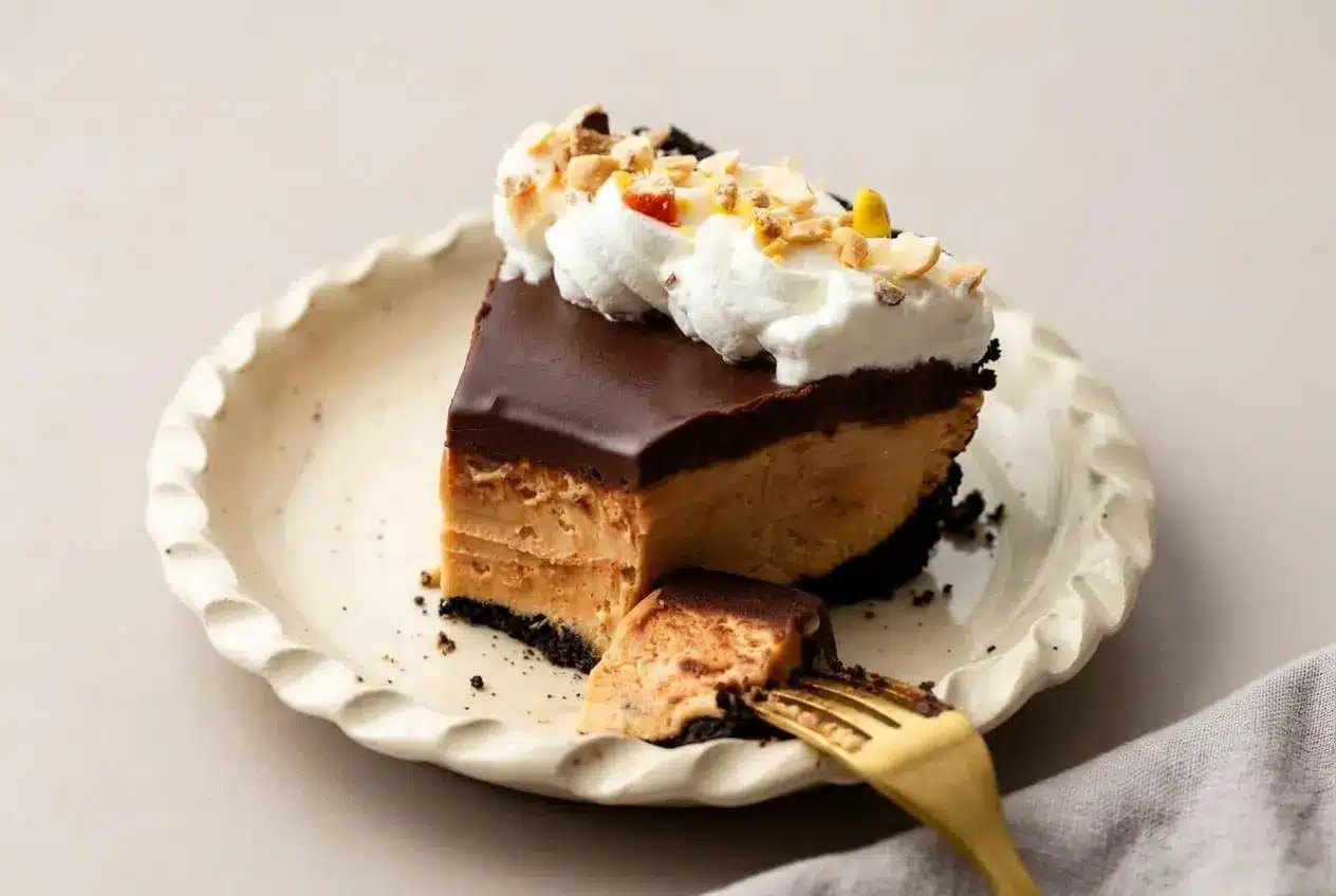 Peanut butter pie recipe with a silky chocolate ganache layer, fluffy mousse filling, and dark cookie crust.