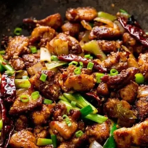 Crispy Szechuan chicken pieces tossed with dried red chilies and a glossy chili bean glaze.