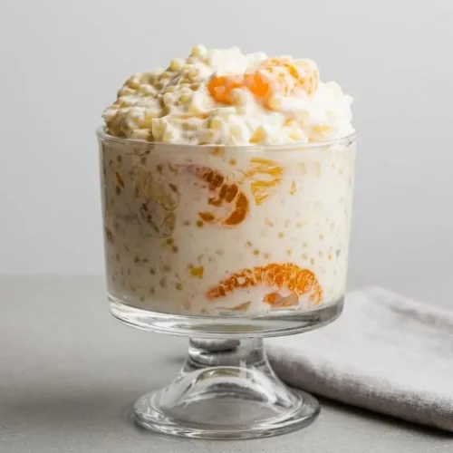 Creamy frog eye salad loaded with tender acini de pepe pasta, mandarin oranges, pineapple, and mini marshmallows.