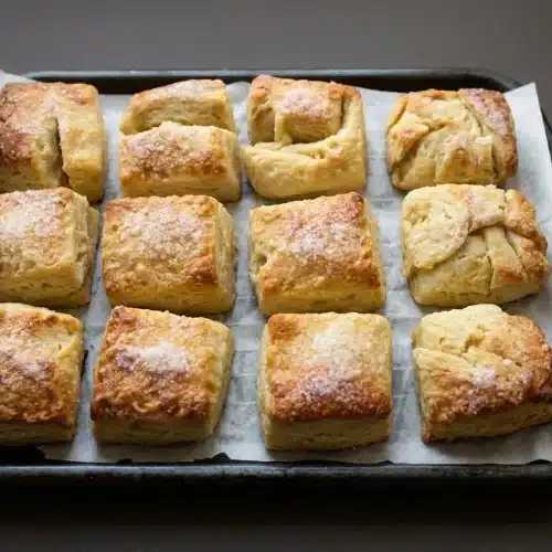 Freshly baked golden Irish butter scones sprinkled with sugar and flaky sea salt.