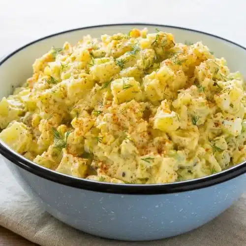 Potato salad recipe featuring tender Yukon Gold potatoes in a creamy dressing with hard-boiled eggs and fresh dill.