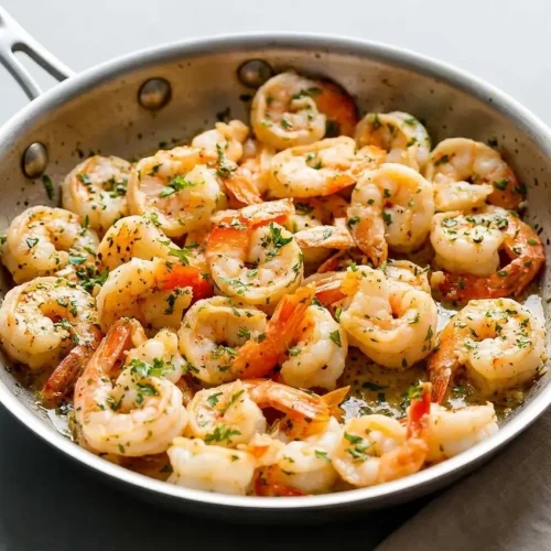 Tender pink shrimp scampi recipe tossed in a glossy garlic butter sauce with fresh parsley.