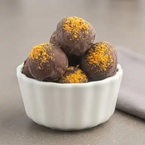 Chilled butterfinger balls coated in smooth semi-sweet chocolate with crushed candy bar topping.