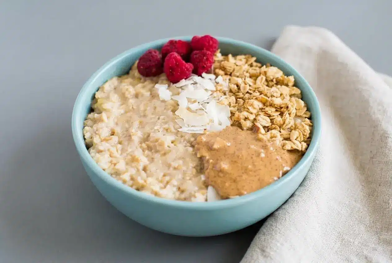 Fluffy egg white oatmeal in a ceramic bowl with a creamy, soft cloud-like finish.