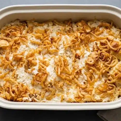 French onion chicken bubble up baked golden brown with bubbly sauce and crispy fried onions.