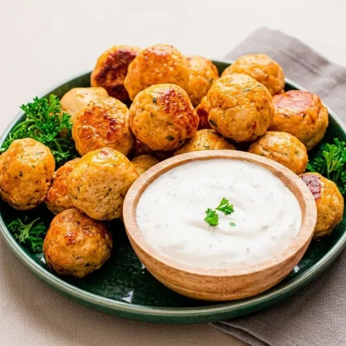 Golden skillet-seared ranch chicken meatballs with herb flecks and a juicy tender center