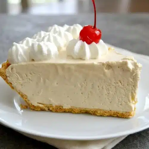Frozen root beer float pie with a creamy tan filling and crisp graham cracker crust