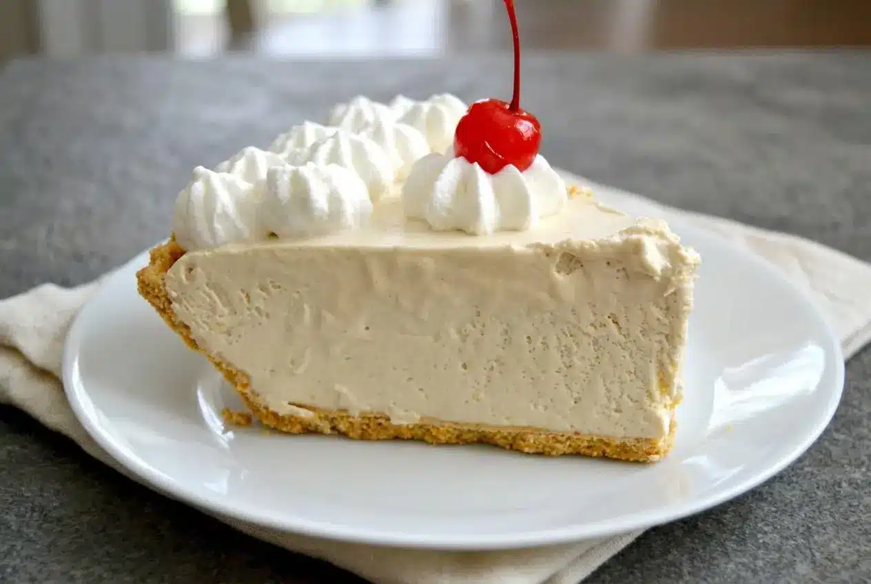 Frozen root beer float pie with a creamy tan filling and crisp graham cracker crust