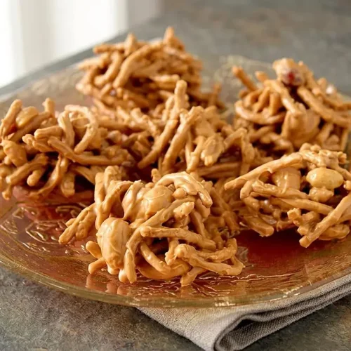 Peanut butter haystacks with crispy chow mein noodles, salted peanuts, and a creamy butterscotch coating.